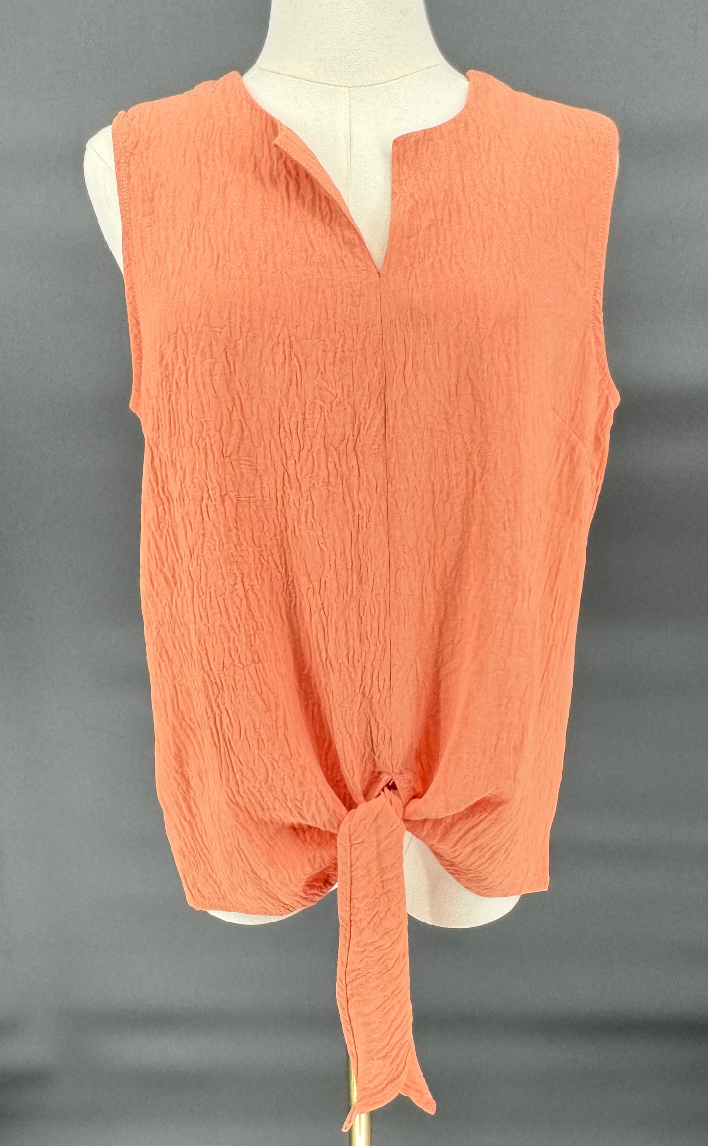 PEACH WOVEN SLEEVELESS TOP WITH V-NECK AND OPEN BOTTOM TIE DETIAL