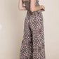 WOVEN SMOCKED BACK SLEEVELESS JUMPSUIT WITH FAUX WRAP